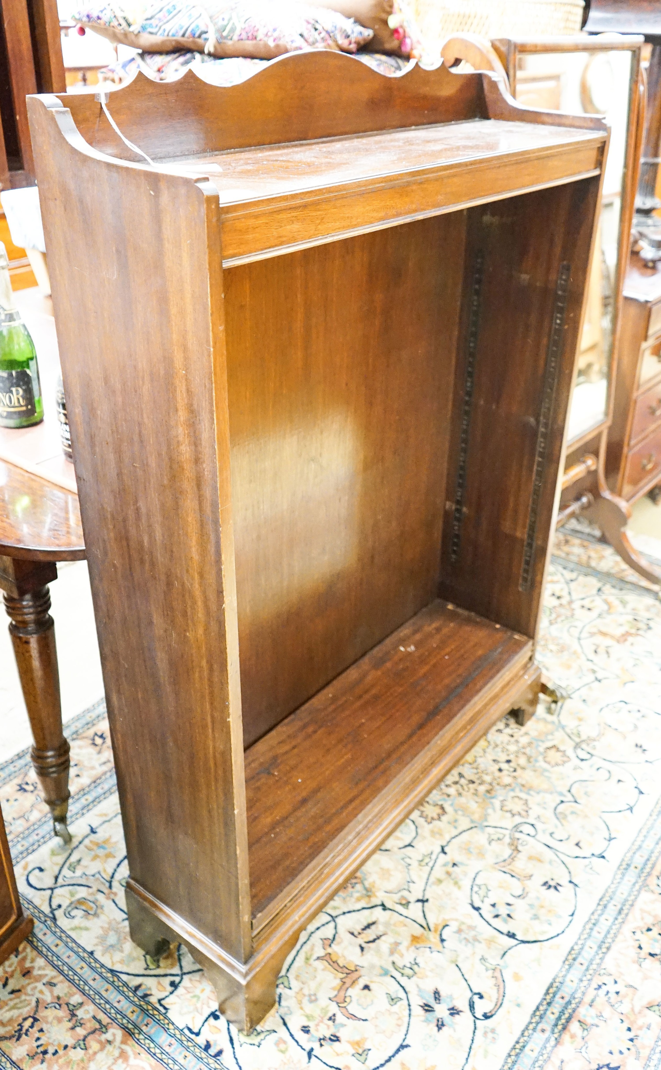 A 1920's mahogany open bookcase, length 92cm, depth 25cm, height 130cm